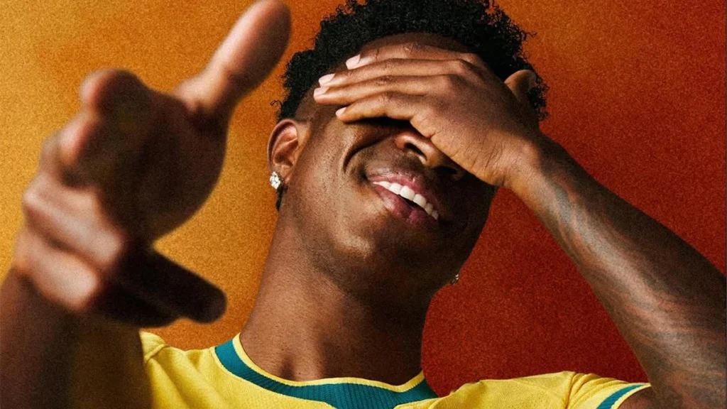 Vinícius Jr smiling in Brazil jersey for smile before and after article
