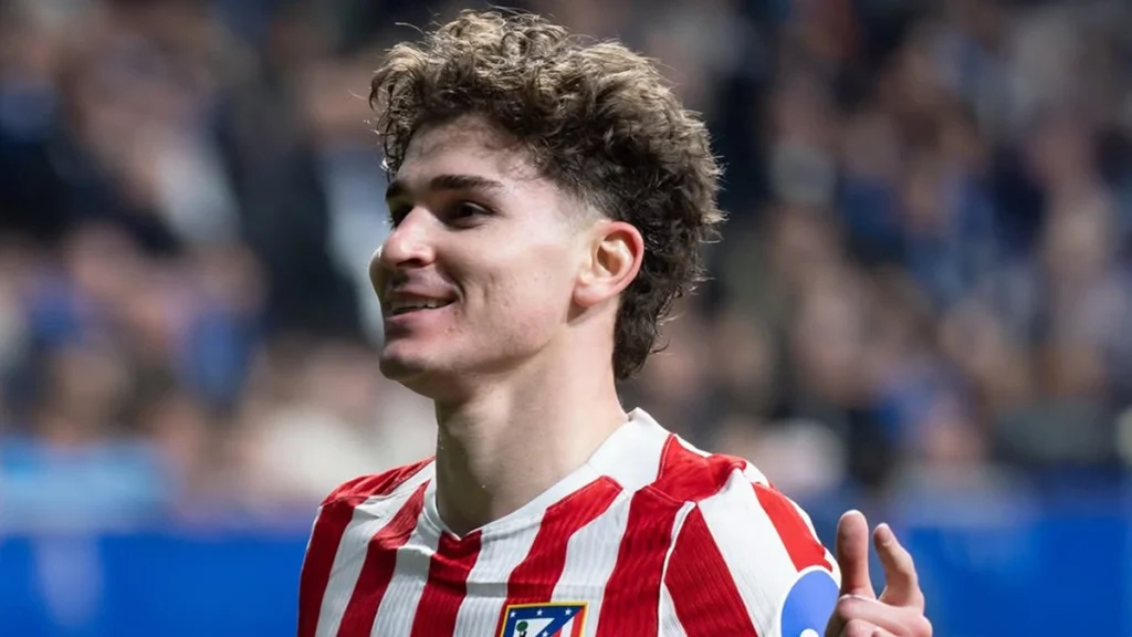 Julián Álvarez smiling during a football match