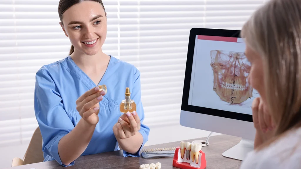 Dentist discussing dental implant options after cancer treatment