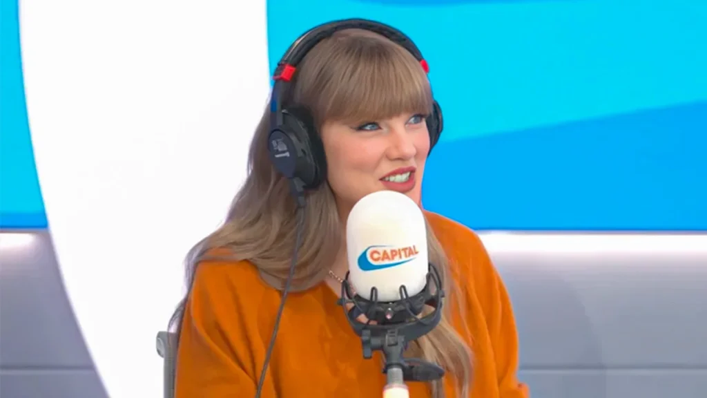 Celebrity smiling during a radio interview, highlighting public image and recognizable smiles