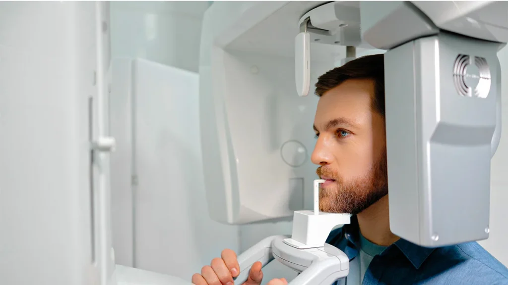 Patient undergoing a CBCT dental scan for All-on-6 and All-on-8 implant treatment planning in Turkey.